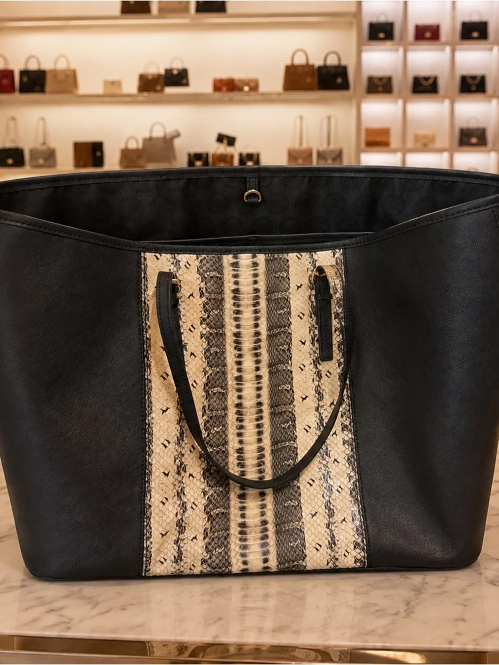 Michael Kors Saffiano leather paired in anaconda or python-print center